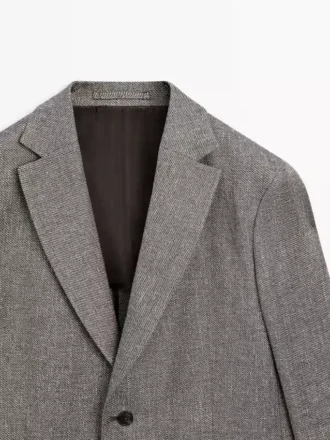Blazer sartoriale in misto lino a spina di pesce