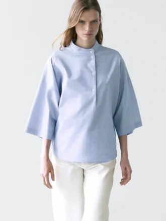 Camicetta fluida con dettaglio del colletto abbottonato