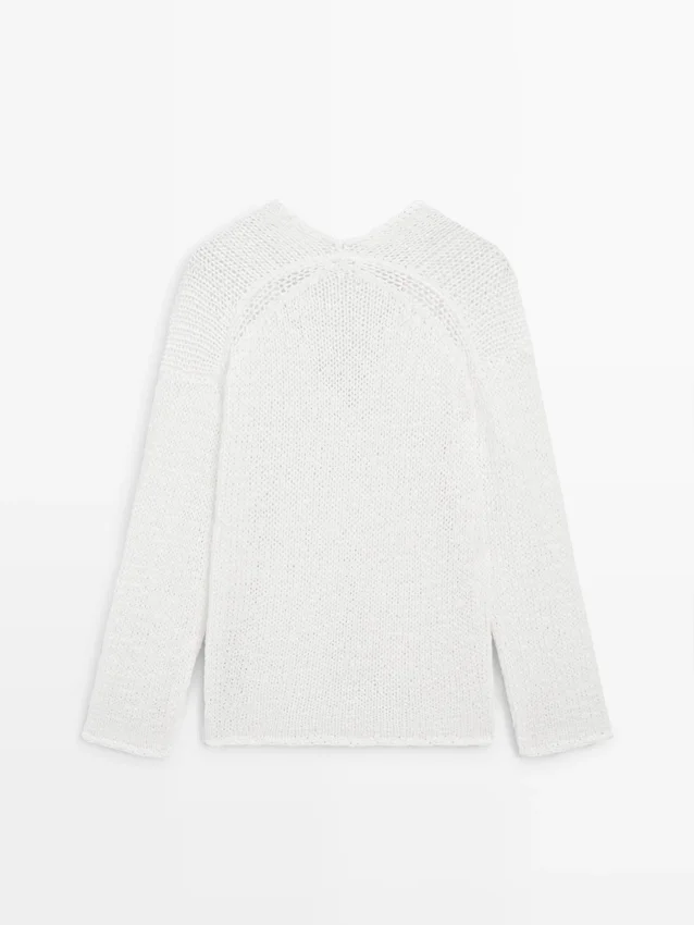 Maglione con scollo a V traforato Maglione con scollo a V traforato