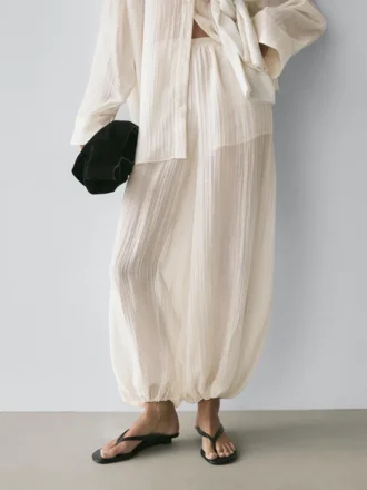 Pantaloni sarouel fluidi con dettagli a pieghe